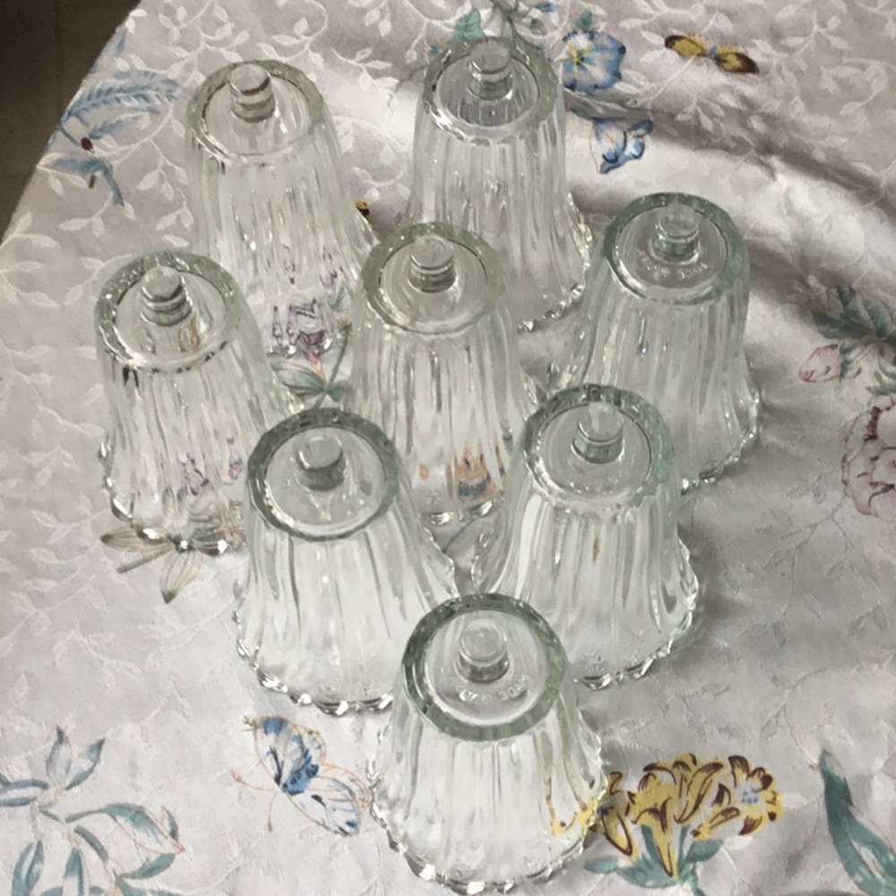 Set of eight  clear Homco Royal Ribbed peg votive cups.